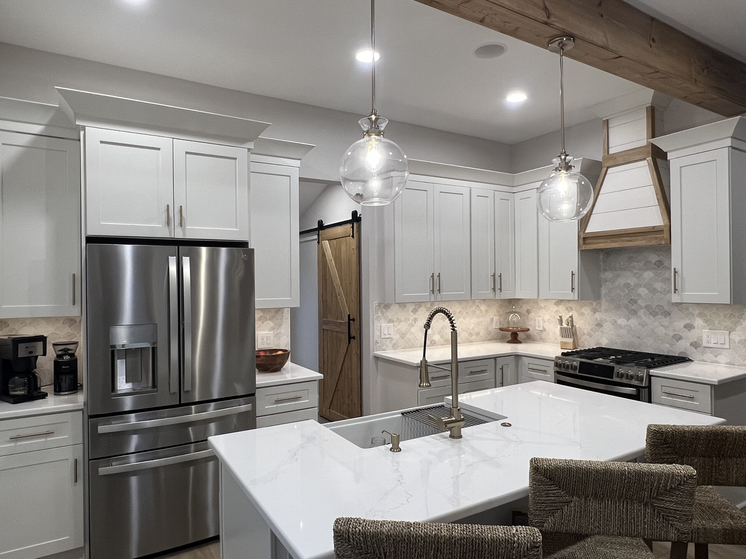 Modern kitchen lighting upgrade with pendant lights and stylish fixtures.